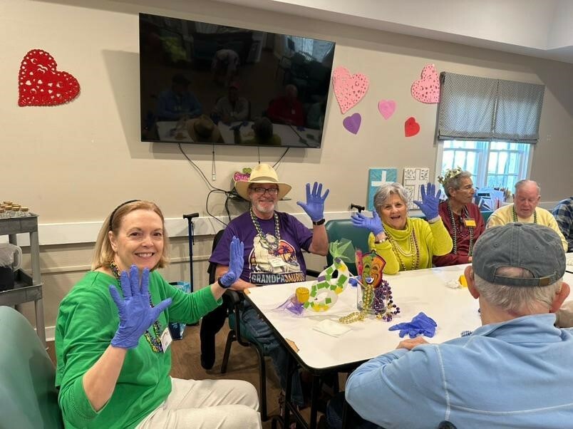 Participants and volunteers celebrating together at Hope Arbor